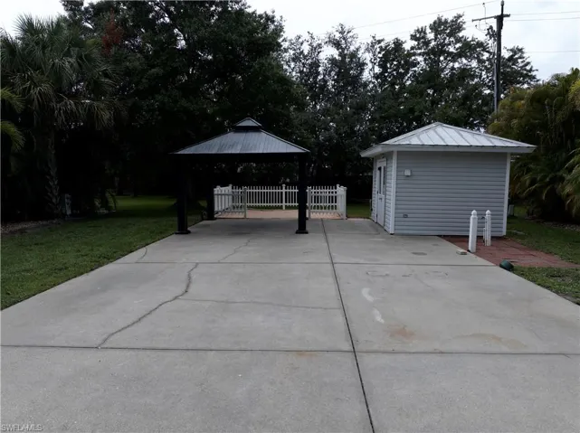 View of patio featuring a gazebo and an outdoor structure