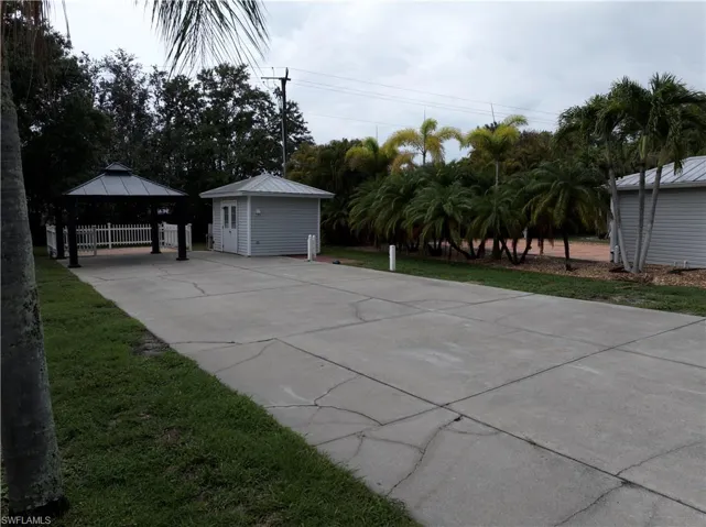 View of patio with a gazebo and driveway