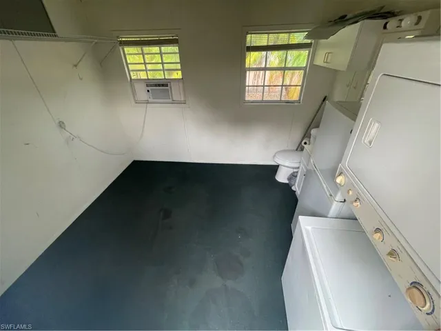 building with stacked washer and dryer and cooling unit