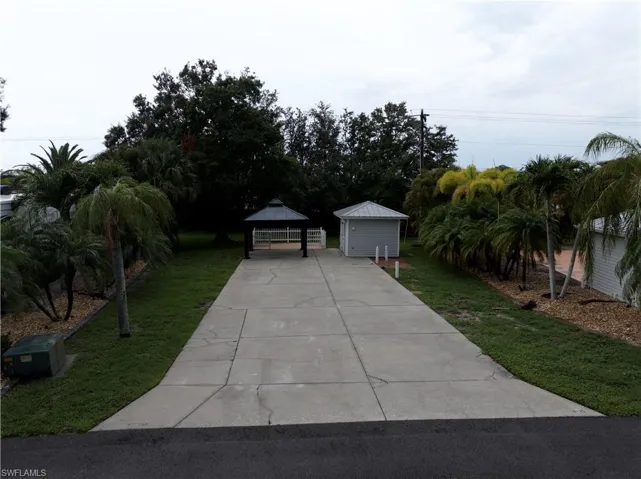 View of front of house featuring a front yard and a gazebo