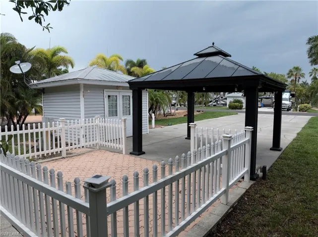 Wooden terrace featuring a gazebo