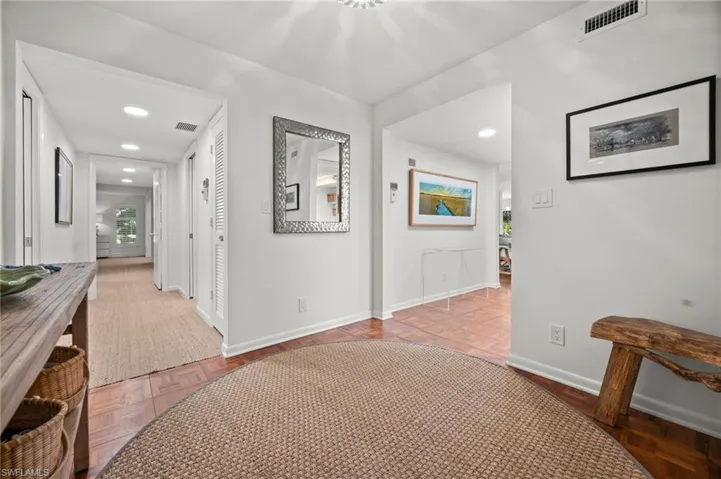 Foyer leads to separate living and bedroom are!