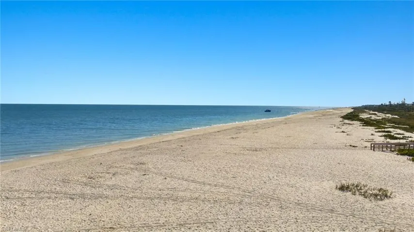 Property view of water featuring a beach view