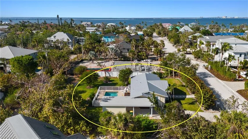 Drone / aerial view with a water view and a residential view
