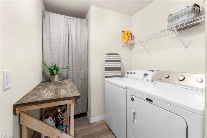Full bathroom featuring vanity, tile patterned flooring, and a shower with curtain