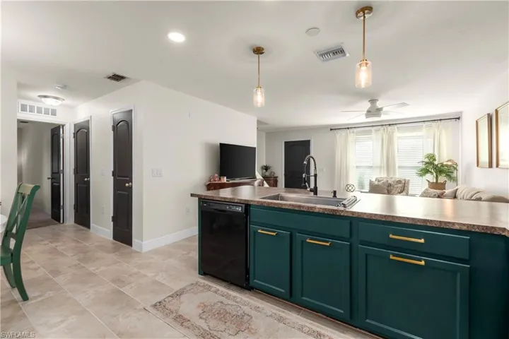 Unfurnished room with light carpet and ceiling fan