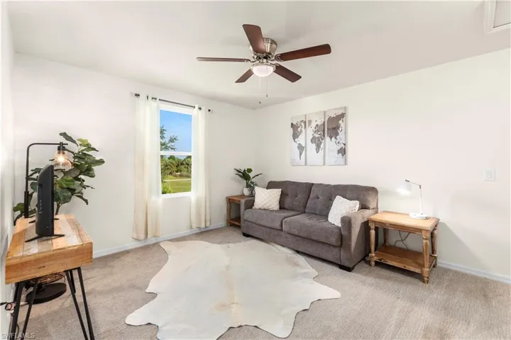 Laundry room with dark wood-style floors and independent washer and dryer