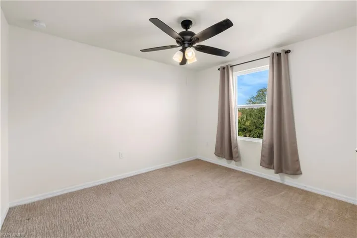 Full bathroom with shower / tub combo, light wood-type flooring, and double vanity