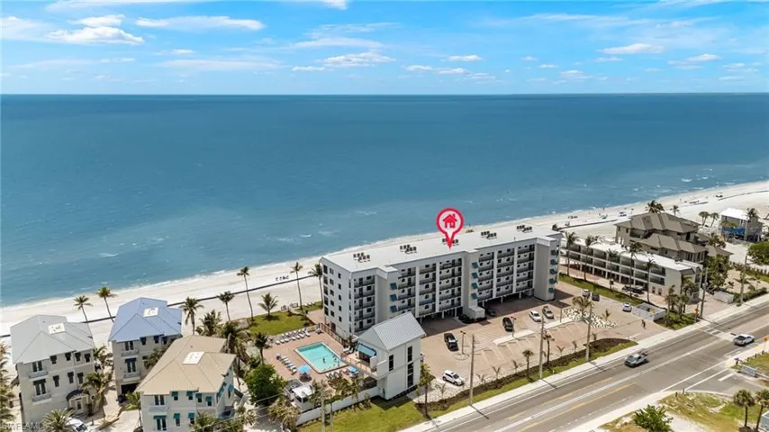 Bird's eye view featuring a view of the beach and a water view