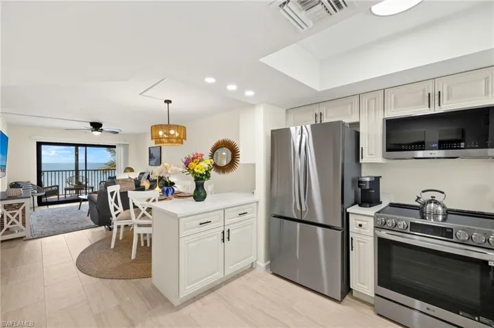 Kitchen featuring stainless steel appliances, light countertops