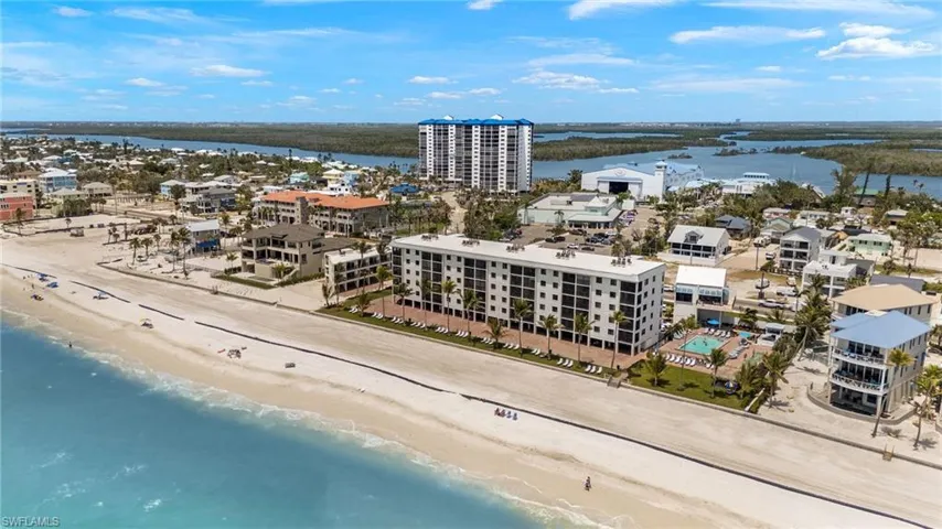 Aerial view featuring a view of the beach and a water view