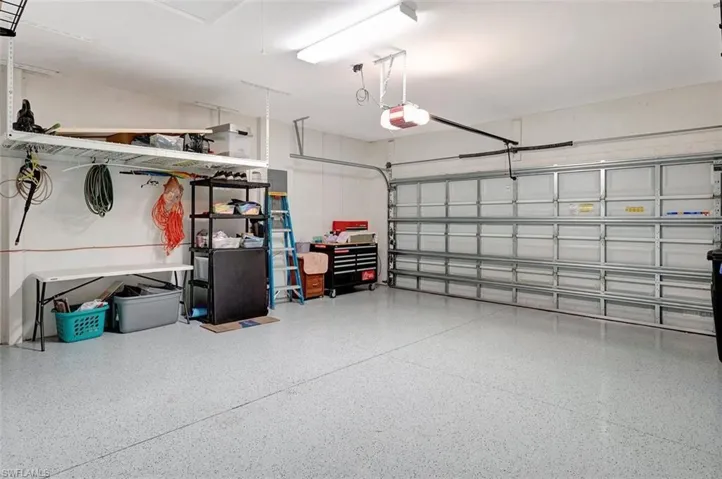 The two-car garage is expanded with garage opener, lighting & epoxy flooring.