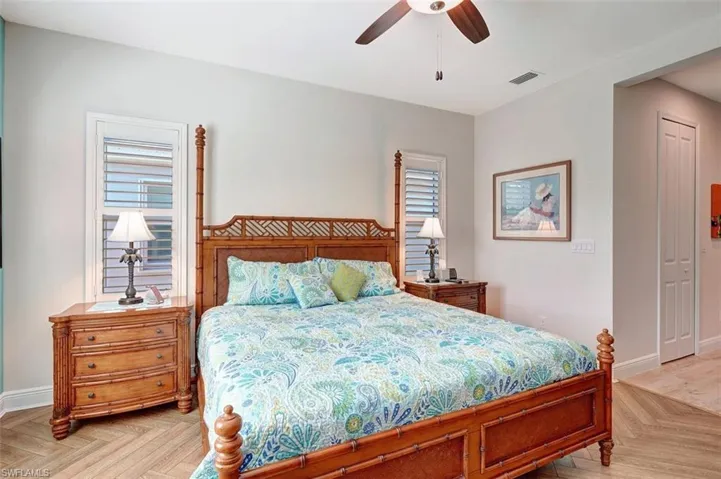 Primary bedroom with plenty of space which leads to the main bathroom.