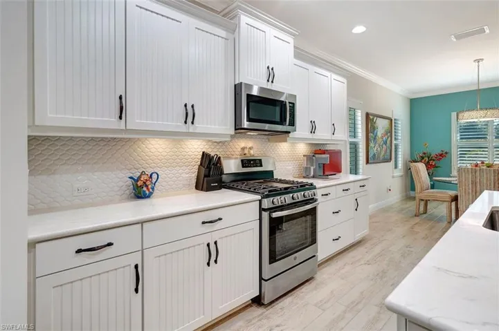 The kitchen is next to the dining room.