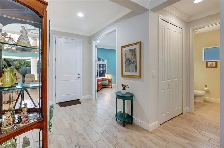 Enjoy the front foyer, front office, hallway, closet to the left & 1/2 guest bathroom!
