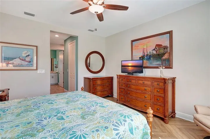 Walk from the main bedroom to the hallway & two master closets.