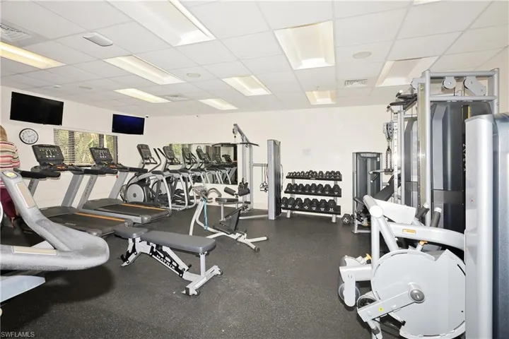 Workout area with a paneled ceiling