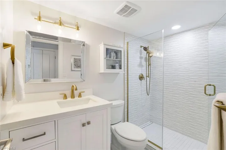 Guest bathroom with enclosed glass shower.  Conveniently located near guest room.