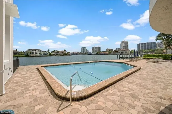View of pool featuring a patio area and gorgeous water views.