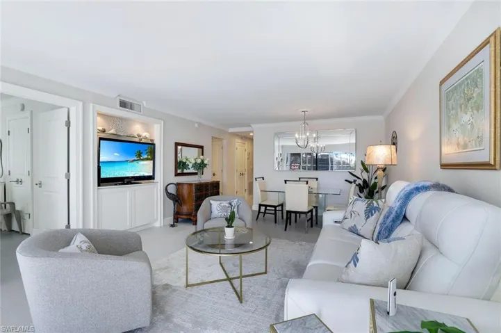 Living room featuring built-in cabinetry for Television.