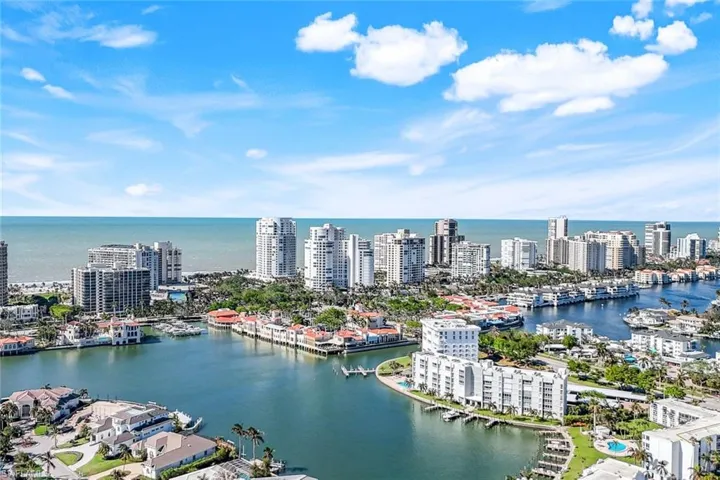 Walk over the bridge to Venetian Village shopping and dining. Steps from Park Shore’s private membership beach.