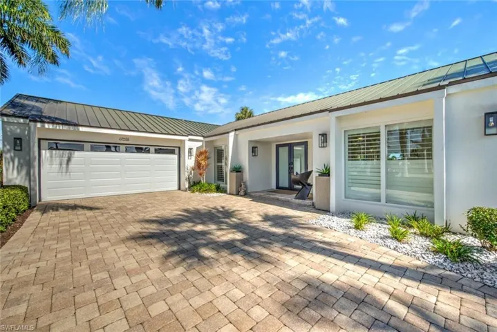 Single story home featuring a garage
