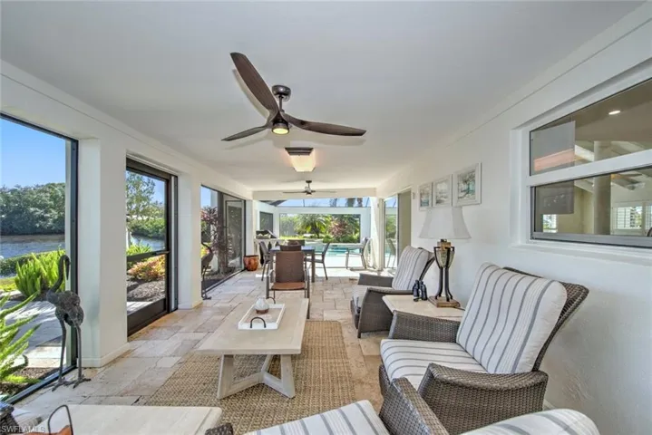 Sunroom with a water view