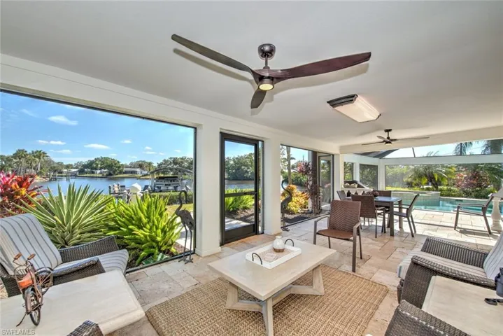 Sunroom with a water view