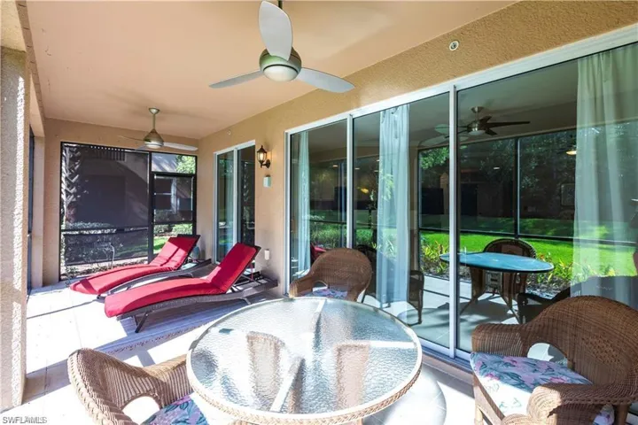 Sunroom featuring a ceiling fan and outdoor dining space