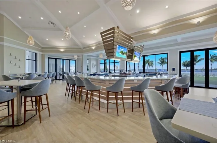 Dining room featuring light wood-style flooring, recessed lighting, and lofted ceiling