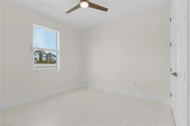 Empty room with baseboards and light wood-style floors