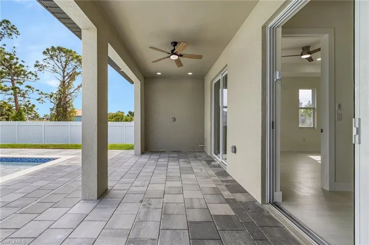 View of patio featuring ceiling fan