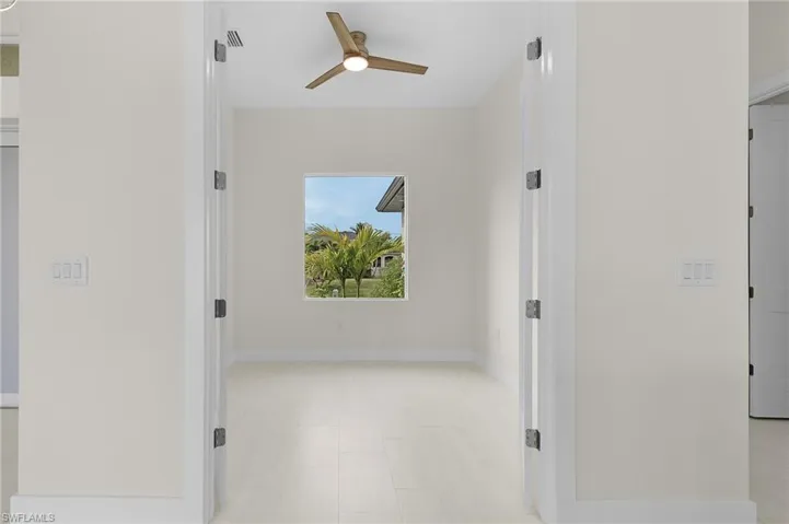 Hallway featuring baseboards