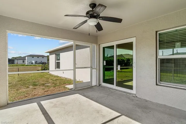 Unfurnished sunroom with a ceiling fan