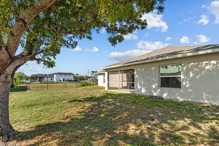 View of yard with a sunroom
