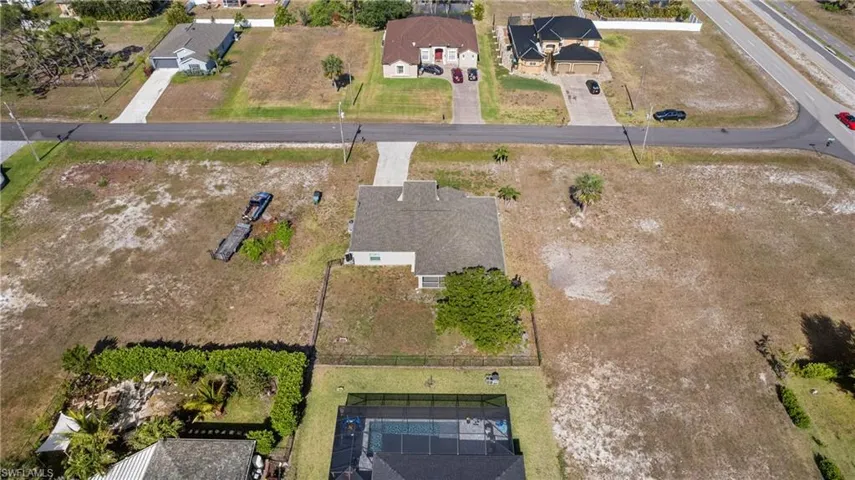 Aerial view of property's location featuring nearby suburban area