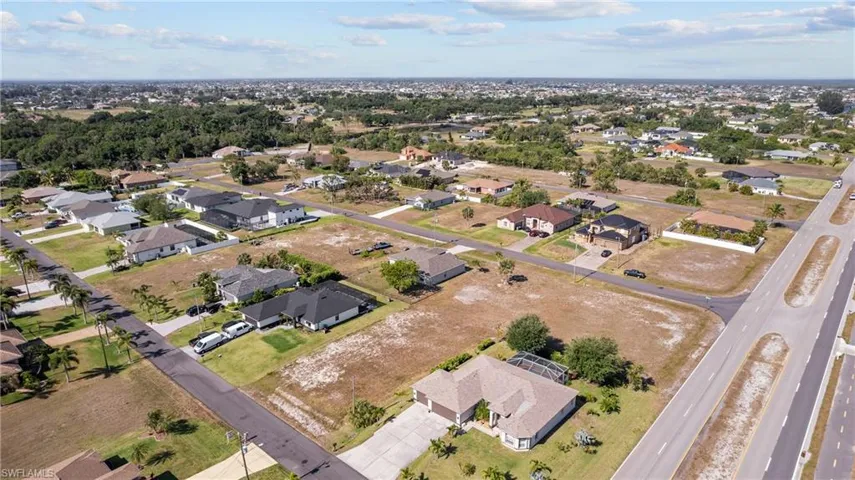 View of property location with nearby suburban area