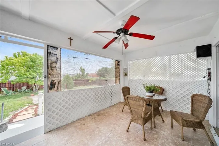 Sunroom featuring ceiling fan