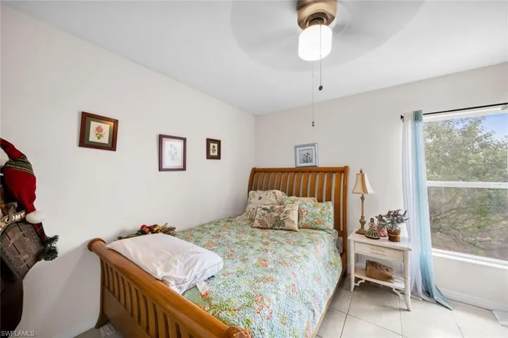 Tiled bedroom with ceiling fan