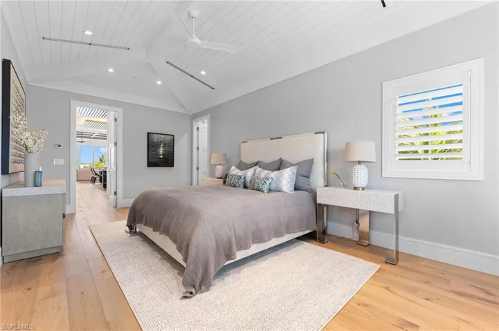 Bedroom featuring recessed lighting, light wood-style floors, wood ceiling, baseboards, and ceiling fan