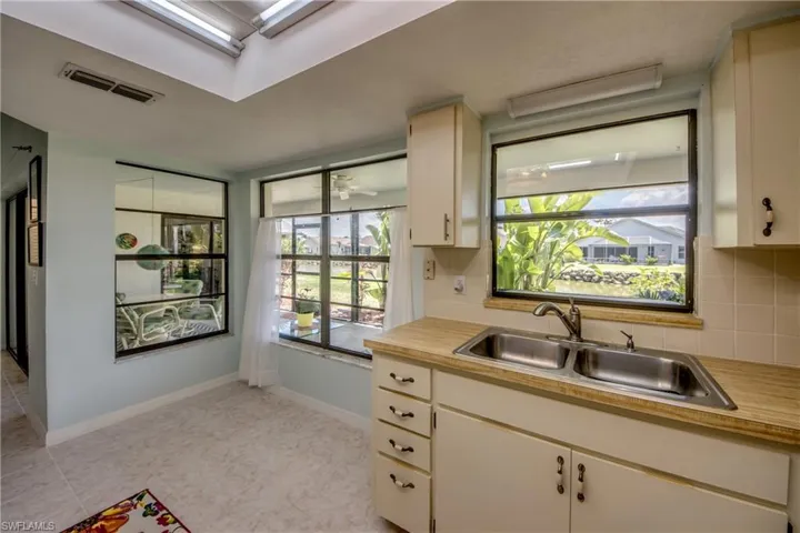 LOOKING TO LANAI AND LAKE.  EVEN A GREAT VIEW WHEN STANDING AT THE SINK.