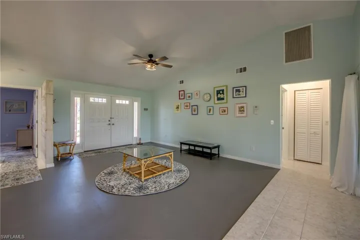 GREAT ROOM LOOKING TO DOUBLE ENTRY DOORS AND FOYER.