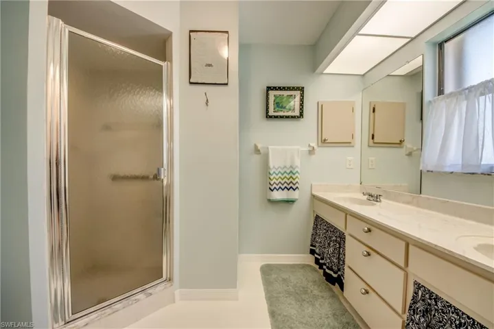 MASTER BATH WITH DUAL VANITY AND NEWER COMMODE