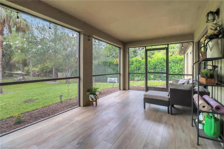Unfurnished sunroom with a wealth of natural light