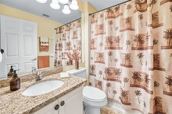 Full bathroom featuring vanity and shower / bath combo
