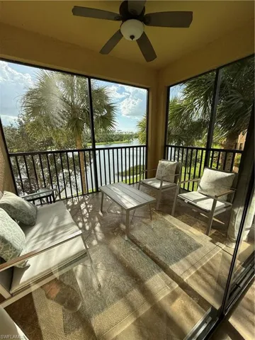 Sunroom with a water view
