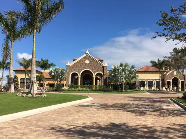 View of property featuring decorative driveway