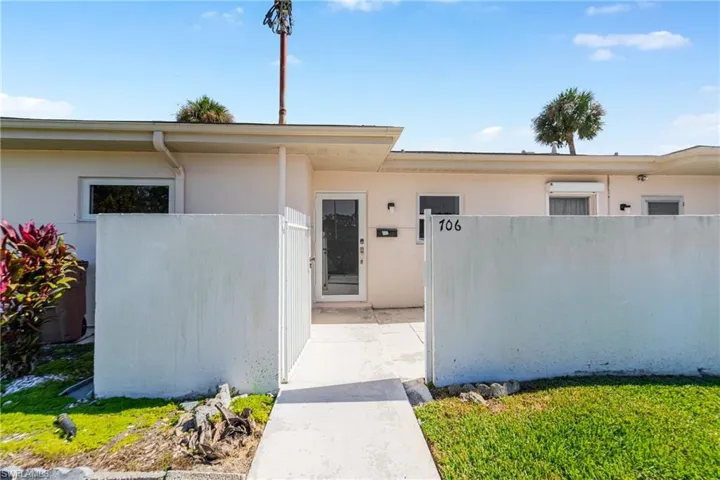 View of exterior entry featuring stucco siding