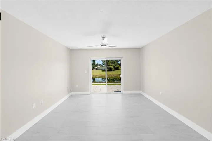 Unfurnished room featuring ceiling fan and a textured ceiling