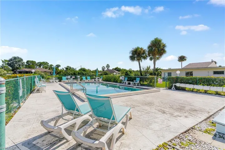 Community pool with a patio area